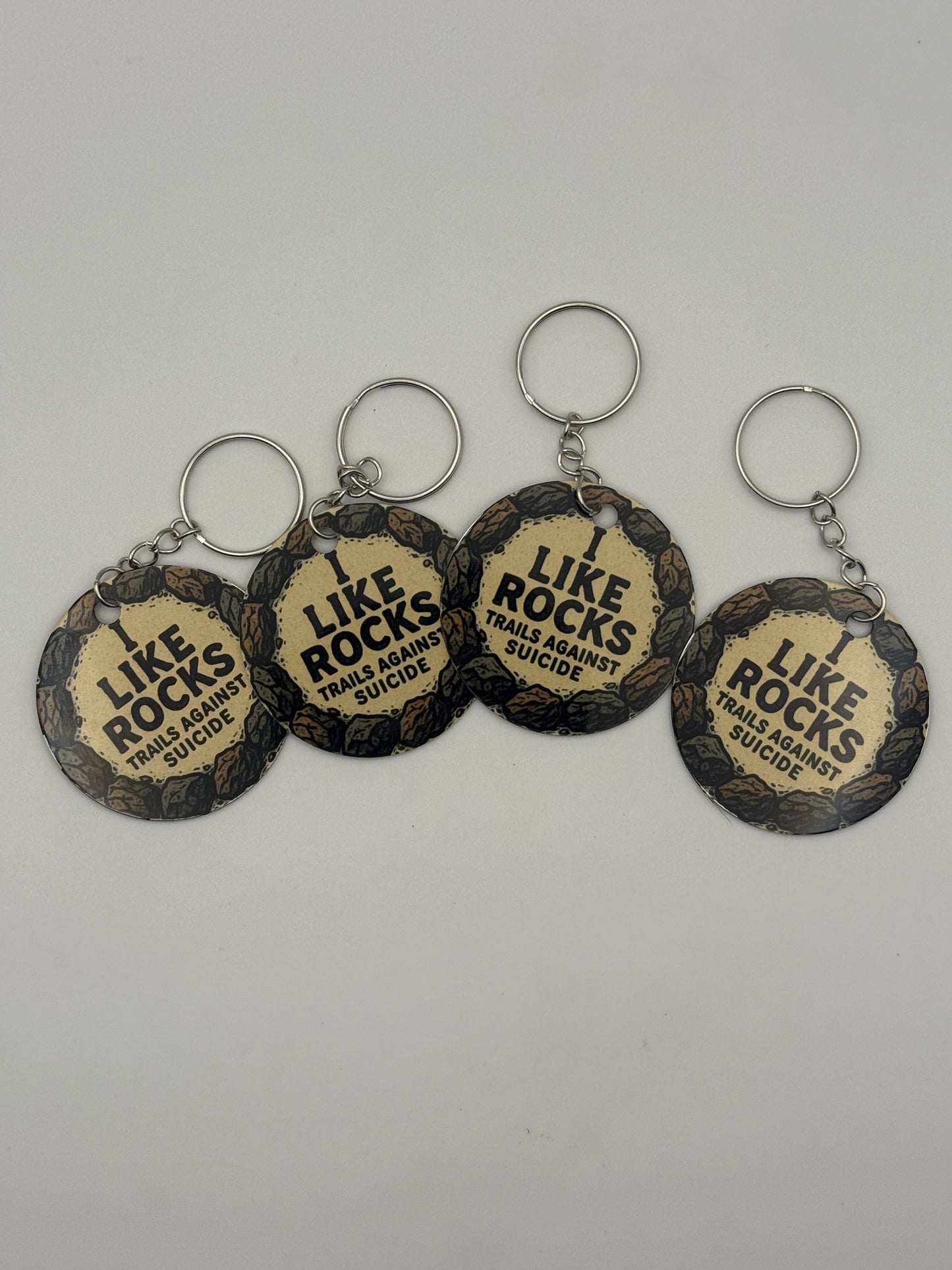"I Like Rocks" Trails Against Suicide Circle Keychain.