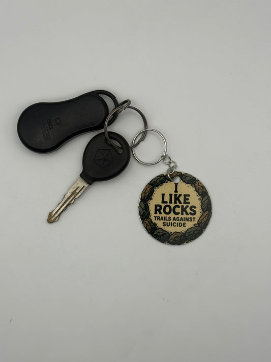 "I Like Rocks" Trails Against Suicide Circle Keychain.