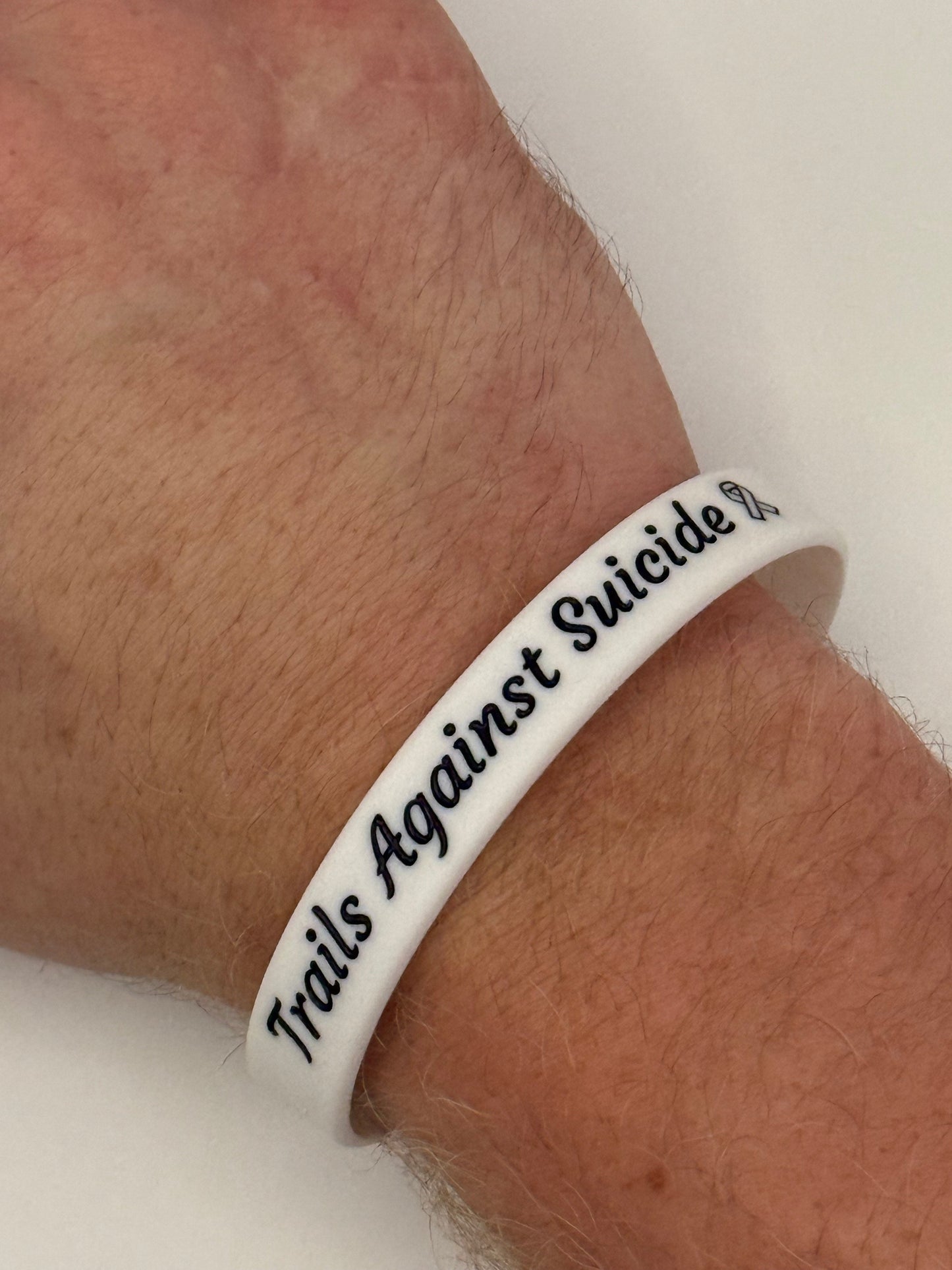 Trails Against Suicide Wristbands.
