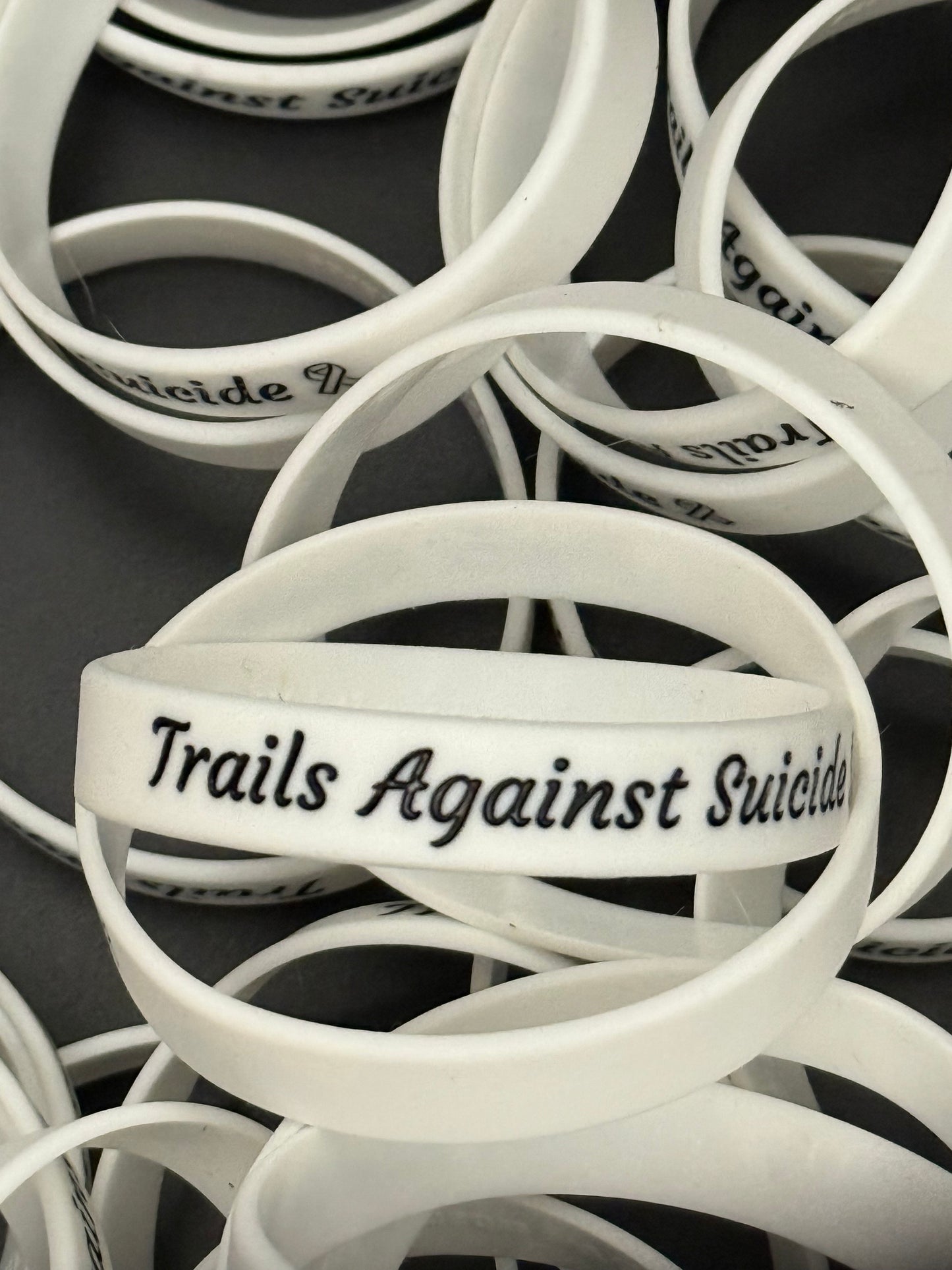 Trails Against Suicide Wristbands.